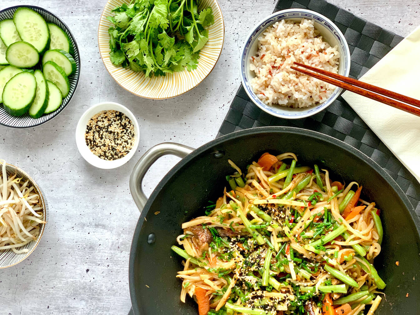 vegan Asian wok recipe with bamboo shoots, carrots, mung bean sprouts, sesame seeds, garlic, shiitake mushrooms, soy sauc, chili, eggs